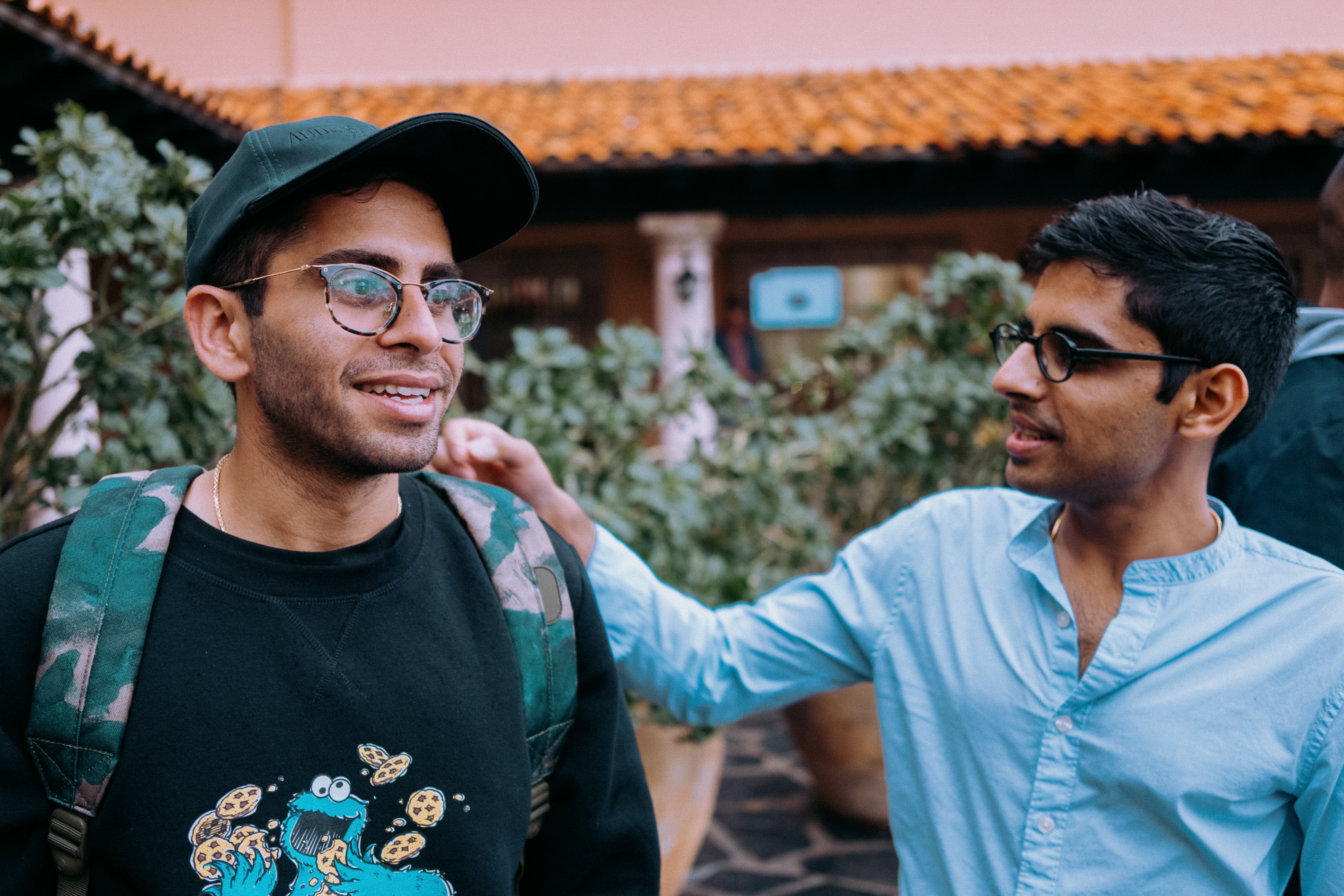 Two young friends talking.